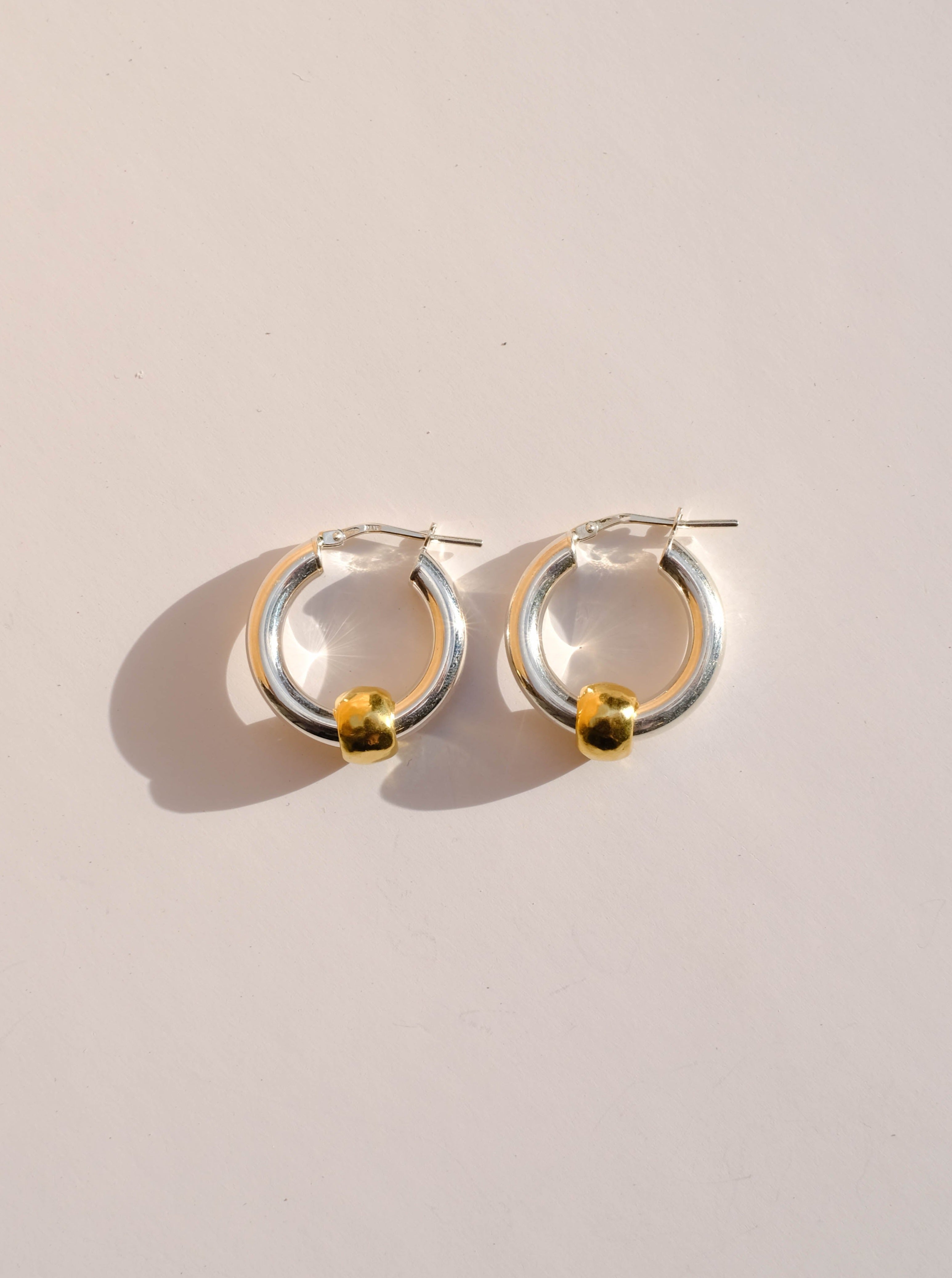 Silver hoops, gold plated pellet earrings